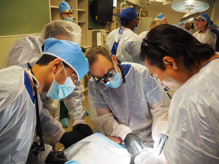 Lab members performing work on a cadaver