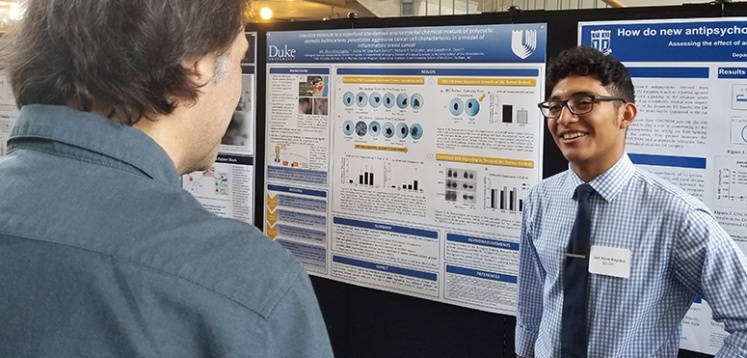 Photo: Undergraduate student Ulises Nino-Espino from Dr. Gay Devi's lab presents his abstract for the Duke Biological Sciences Undergraduate Research Fellowship (B-SURF)