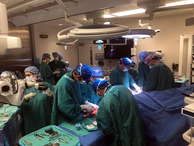 Duke Health team performing bilateral hand transplant in the OR