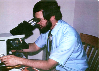 William Berry, MD, at the microscope early in his career