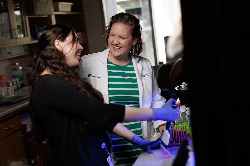 Dr. Crosby and team member working in lab