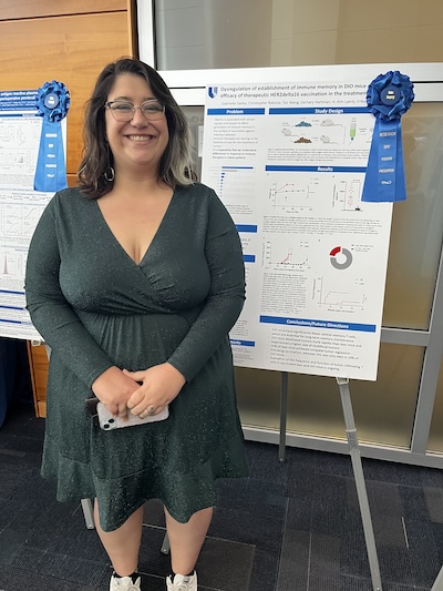 Woman in front of research poster