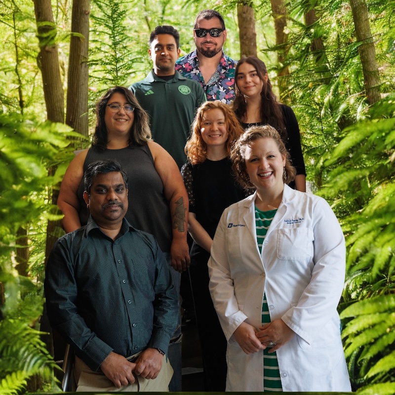 Crosby lab members in front of forest backdrop