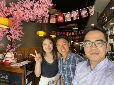 Three people taking a selfie in a restaurant