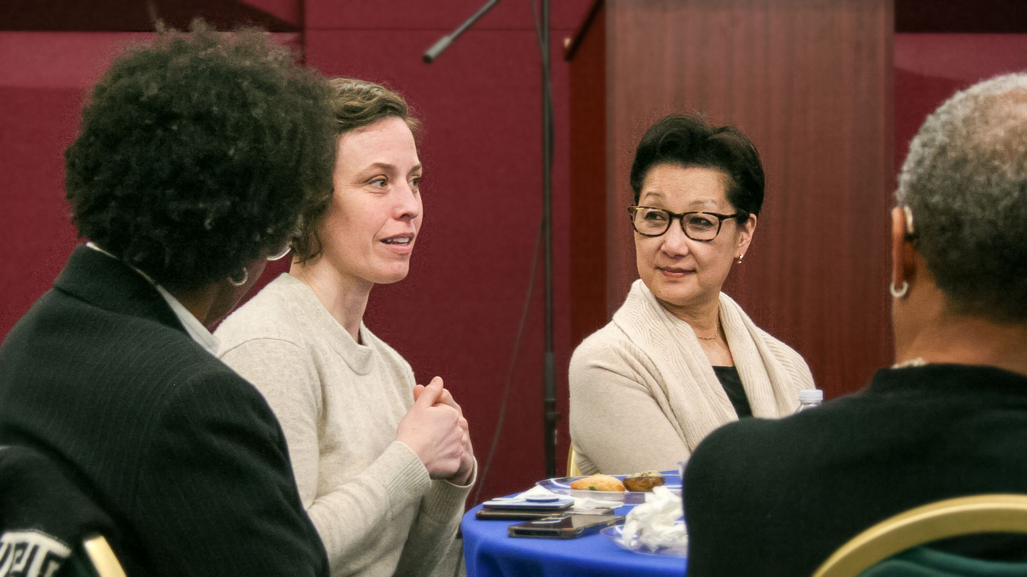 Photo of women speaking and listening at an SEEDS event