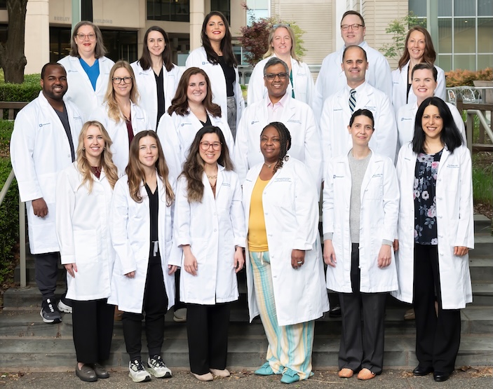 Trauma faculty standing in a group on stairs