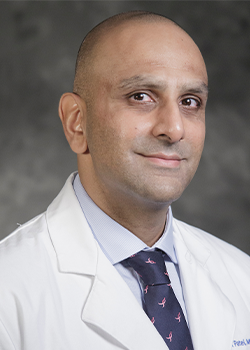 Headshot photo of Dr. Ash Patel in his white coat