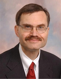 Professional headshot photo of Dr. Allan H. Friedman