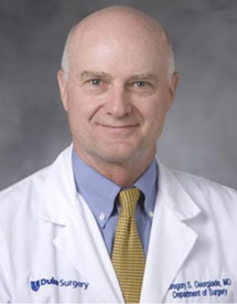 Professional headshot photo of Dr. Gregory Georgiade wearing his white Duke Surgery coat