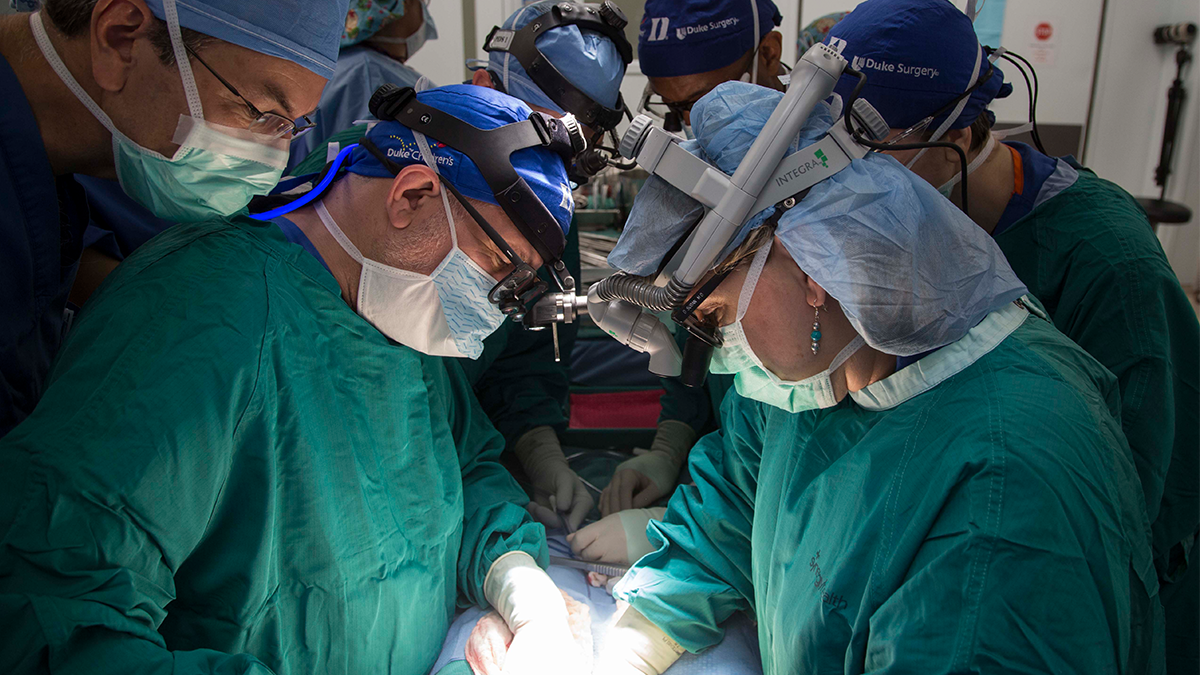 Dr. Debra Sudan performs a surgery with a team in Singapore