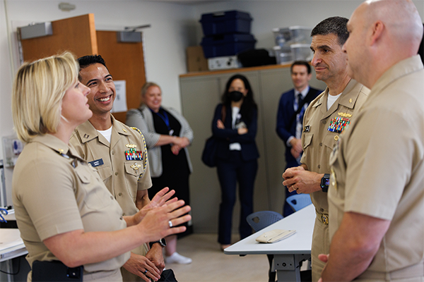 Officials from the U.S. Navy Medicine converse at Duke Health