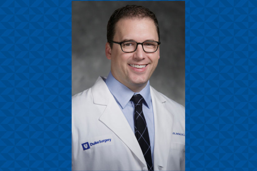 Photo of Dr. Ryan Antiel in white coat over a blue geometric background