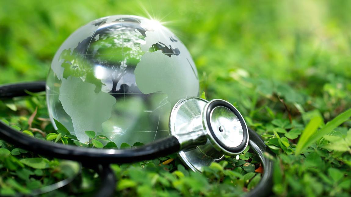 Image of a stethoscope wrapped around a glass globe