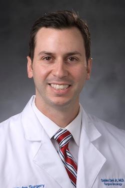 Dr. Sabino Zani in white coat
