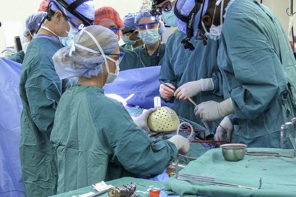 The Duke University Hospital surgical team works to implant an artificial heart in a 39-year-old patient.