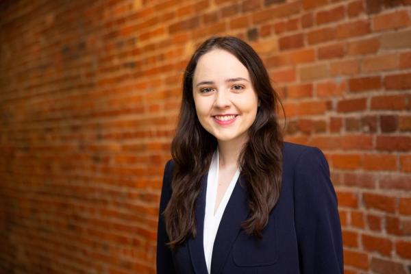 Duke Senior Alexandra Bennion stands in front of a brick wall