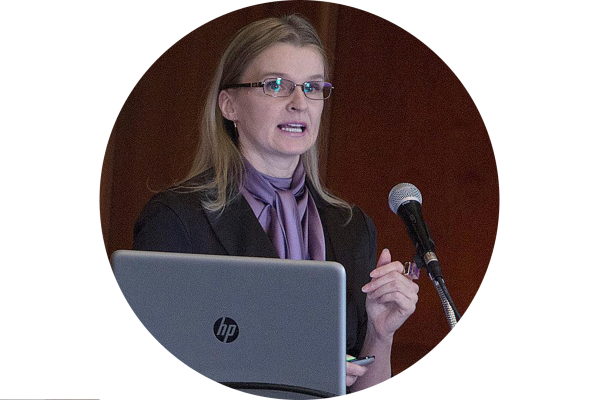 Dr. Yuliya Krauchanka speaking at a conference