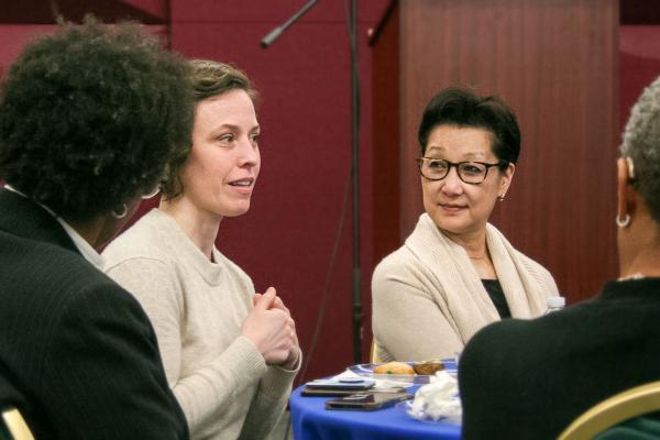 Photo of women speaking and listening at an SEEDS event