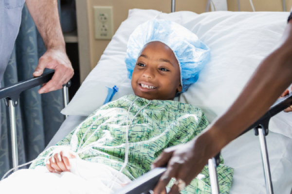 Child patient in hospital bed