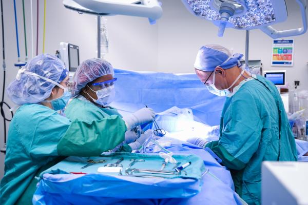 Surgeons operating in an operating room