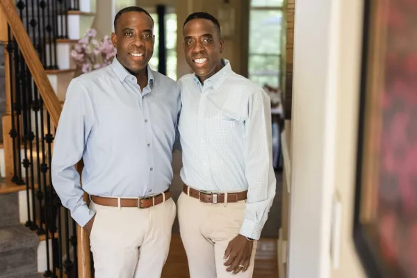 Twins Jamont and Javon Beatty stand inside Jamont's home in Durham, NC