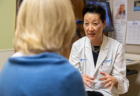 Shelley Hwang talks to patient