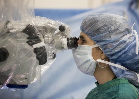 Surgeon performing hand transplant