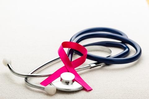 stock image of stethoscope and breast cancer awareness ribbon