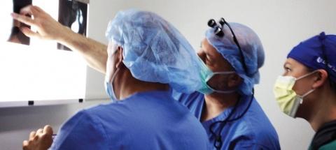 Surgeons examining X-ray images in Guatemala