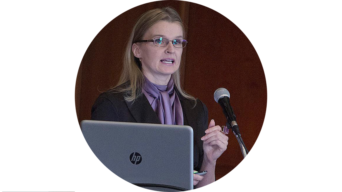 Dr. Yuliya Krauchanka speaking at a conference