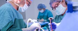 Surgeons operating in an operating room