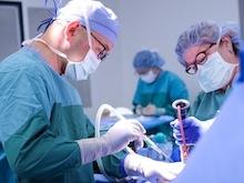Surgeons operating in an operating room