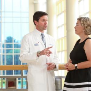 Jonathan Routh, MD, Pediatric Urologist, in conversation with Deanna Adkins, MD, Pediatric Endocrinolgist and Clinic Director. By Huth Photo.