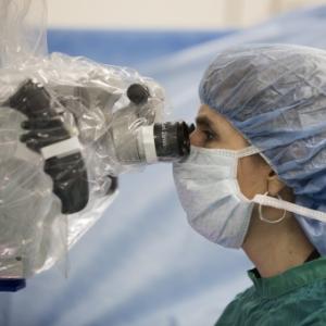Surgeon performing hand transplant