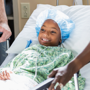 Child patient in hospital bed